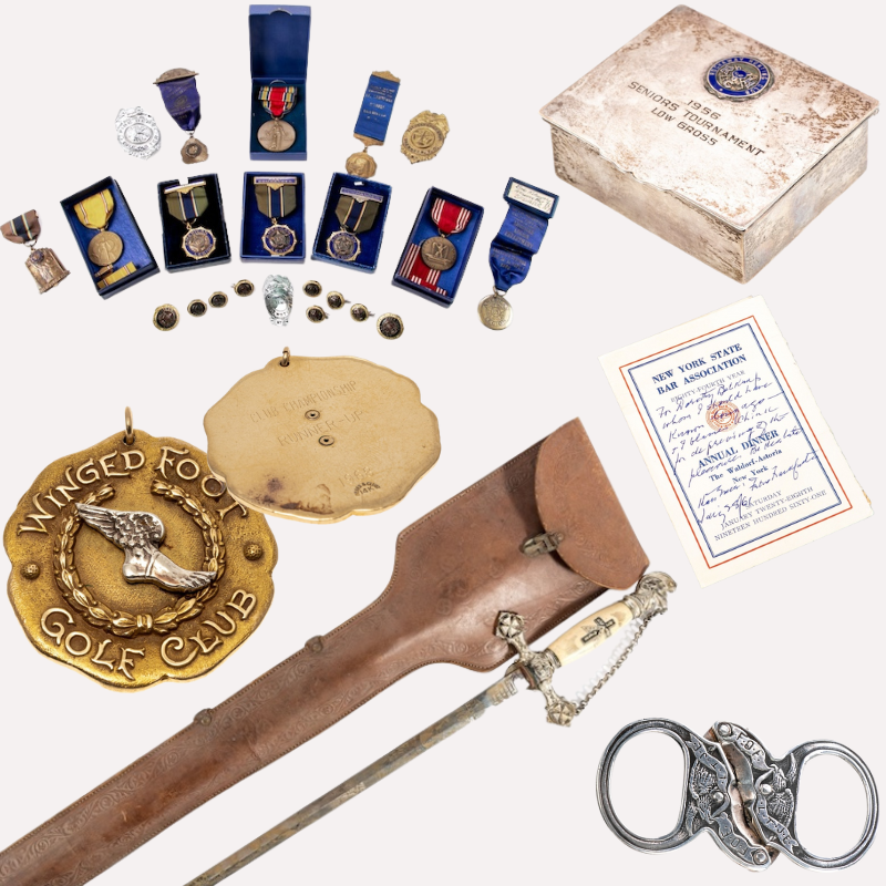 An assortment of items from various organizations, groups, societies and orders includes medals, honorary sword, pendant, certificate, silver trinket box, and cigar cutter